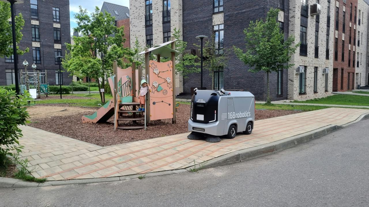 an electric vehicle parked in front of a playground